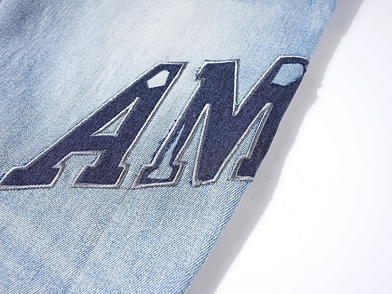 AMIRI Light Blue Distressed Paneled Jeans — detail
